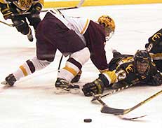 CC's Mark Cullen (17) scored a goal and added an assist despite suffering a likely broken nose early.