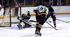 Colgate goalie Jason LeFevre gets down to stop a shot from Ferris State's Rob Collins (23) during the Bulldogs' 5-4 win Friday