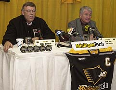 Mike Sertich (left) and Michigan Tech athletic director Rick Yeo at a press conference to announce Sertich's permanent hiring as head coach of the Huskies.