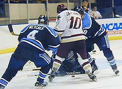 Jeff Giuliano tries to get the puck past the Maine defense