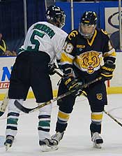 CC goalscorer Alex Kim (right) battles UND's David Lundbohm.