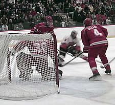 Plattsburgh's Niklas Sundberg made 35 saves, including this on RIT's Peter Bournazakis as Cardinal defensemen Jeff Marshall and Peter Ollari (4) look on.