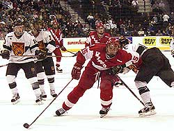 UW's Dany Heatley drives up-ice in traffic.  Photo by Jason Waldowski.