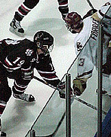 Mike Ryan, who battled off mono for two goals, here battles with BC's J.D. Forrest in NU's 4-3 victory Saturday night.