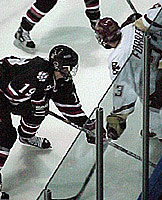 Mike Ryan, who battled off mono for two goals, here battles with BC's J.D. Forrest in NU's 4-3 victory Saturday night.