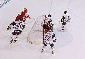 Terrier Brian Collins unsuccessfully attempts a wraparound on NU goalie Keni Gibson.