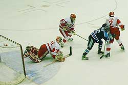 The BU defense scrambles to keep the puck out of the slot.