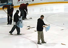 Lynah Rink workers have the messy job of cleaning up. (photos by Mark Anbinder)