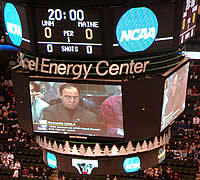 UNH coack Dick Umile glowers from the giant video scoreboard.