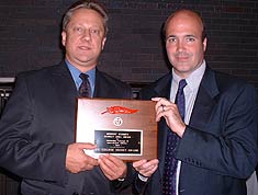 USCHO.com's Dave Hendrickson and Scott Weighart accept the Scarlet Quill Award at the recent Boston University Hall of Fame Banquet.