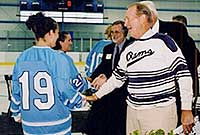 Bradford Boss, who founded the men's club team at URI and donated $1.3 million to the building that will bear his name, meets the URI hockey teams.