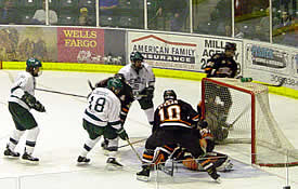 Bemidji's Wade Chiodo tries to stuff a puck past the goaltender. (Photo: Geof F. Morris)