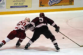 Noah Welch defends against Cornell's Shane Palahicky (photo: eLynah.com).