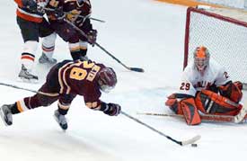 BGSU goalie Jordan Sigalet kept his team in it, here denying FSU's Phil Meyer.