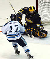 Montoya stops [nl]Maine's Ben Murphy during the 2003 NCAAs. (photo: Christopher Brian Dudek)