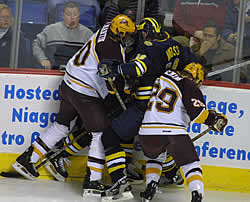 Paul Martin and Jake Fleming sandwich David Moss.