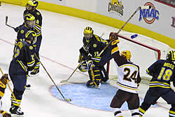 Downcast Wolverines watch Minnesota's Matt Koalska celebrate (photo: Pedro Cancel)