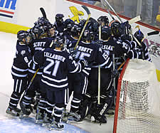 UNH mobs goalie Mike Ayers after a 3-2 win (photo: Pedro Cancel).