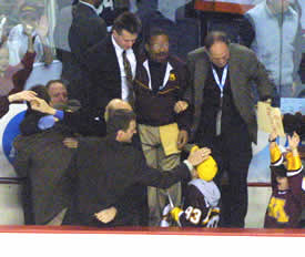 The coaching staff of Minnesota celebrates a second straight NCAA Championship (Photo: Pedro Cancel)
