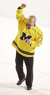 Michigan PA announcer Glen Williams leads the Yost Arena crowd through a rendition of Hail to the Victors. (photos: UM Photo Services)
