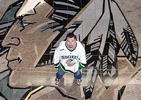 North Dakota goalie Marc Ranfranz embraces his Sioux heritage, and says the team's logo honors Native Americans.