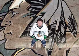 North Dakota goalie Marc Ranfranz embraces his Sioux heritage, and says the team's logo honors Native Americans.