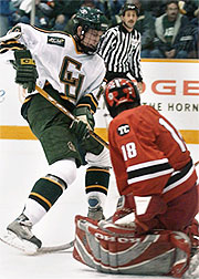 Clarkson's Mike Sullivan tries to slip the puck past Rensselaer goalie Nathan Marsters during the third period. (photo: Christopher Lenney)