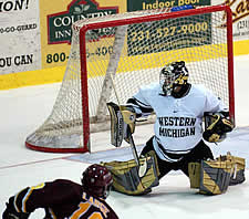 Trevor Large roofs the puck over Mike Mantua to give Ferris State a 1-0 lead late in the first period (photo: Christopher Brian Dudek).