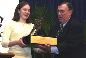 Chanda Gunn accepts the Humanitarian Award from founding trustee John Greenhalgh (photo: Pedro Cancel).