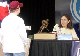 Chanda Gunn signs an autograph after claiming the Humanitarian Award. (Photo: Jack McGinnis)