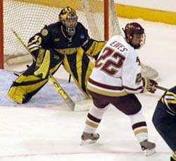 Ben Eaves patrols in front of Wolverine goalie Al Montoya (photos: Kelly McGinnis).