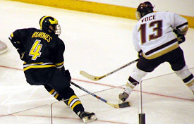 Michigan senior Andy Burnes keeps an eye on BC's Tony Voce. (photos: Kelly McGinnis)