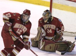 Matt Carle helps clear the net in front of Adam Berkhoel (Photo: Pedro Cancel)