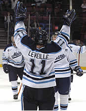 Michel Leveille celebrates 2004's regional win over the Crimson (photo: Tim McDonald).