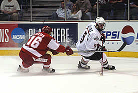 Wisconsin's Adam Burish (l.) chases Ohio State's Sean Collins during the NCAA tournament in 2004, Mike Eaves' first national tourney appearance as Badger coach (photo: Timothy Muir McDonald).