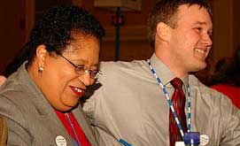 RPI president Shirly Ann Jackson (l.) and AD Ken Ralph react to the news that the amendment allowing scholarships for hockey to continue, had passed.