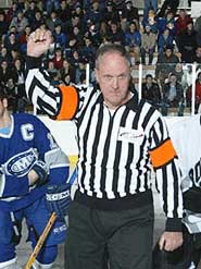 Bill Stewart lines up for a ceremonial drop of the puck.