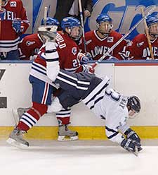 Kim Brandvold runs over New Hampshire's Brett Hemingway. (photo: Josh Gibney)