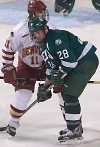 Paul Stastny (l.) and Jean-Guy Gervais match up during Saturday's game.