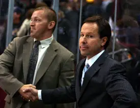 George Gwozdecky (r.) receives congratulations on his 400th career win.