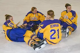 Laura Hurd (2nd from left) and three Elmira seniors make sure they are the last to leave the ice following their final career game. (Photo: Angelo Lisuzzo)