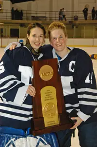 Goaltender Kate Kogut and Captain Jackie Cohen hold the trophy. (Photos: Angelo Lisuzzo)