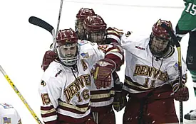 Ulanski (l.) celebrates with Paul Stastny (r.) and teammates during the Pioneers' title-winning matchup against UND in April 2005.