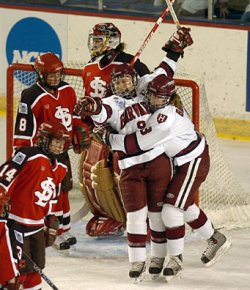 Harvard's Ashley Banfield (3) hugs Nicole Corriero (9) in celebration of the first Crimson goal. (Photos: Josh Gibney)