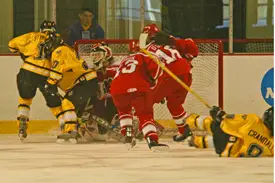 Laura Stypulkowski chips in Gustavus' first goal.  (Photos: Angelo Lisuzzo)