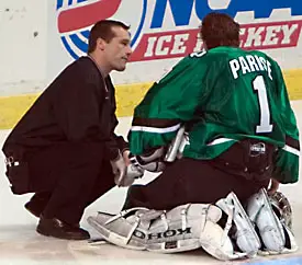 UND's Jordan Parise gets a look from the trainer here, but the netminder hasn't shown much weakness late in the season.