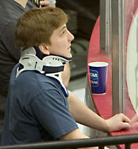 Robbie Bina watches his North Dakota teammates practice Wednesday in preparation for the Frozen Four. (photo: Melissa Wade)