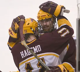 Nate Hagemo (11) and captain Judd Stevens after the Gophers' loss (photo: Melissa Wade).