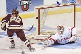 Dan Bertram (l.) hits the post to the right of Charlie Effinger during BC's shutout of Miami (photos: Melissa Wade).