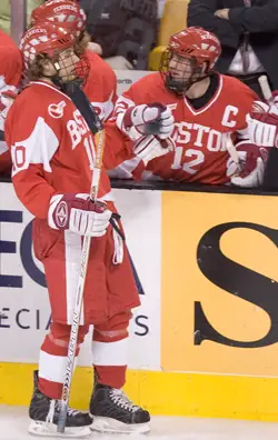 BU's Chris Higgins (l.) is congratulated by captain Brad Zancanaro after his goal against Harvard (photo: Melissa Wade).